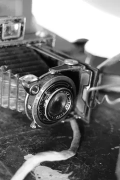 A vintage folding camera up close.